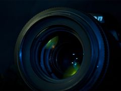 Close-up of a DSLR camera lens, representing high-resolution image delivery