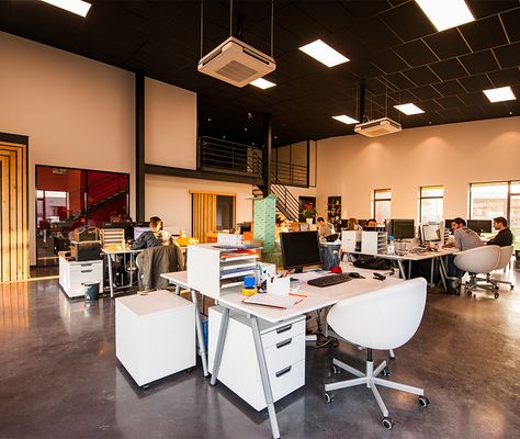 Engineers working at their desks in an open-plan office